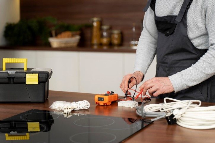 Technician repairing fridge