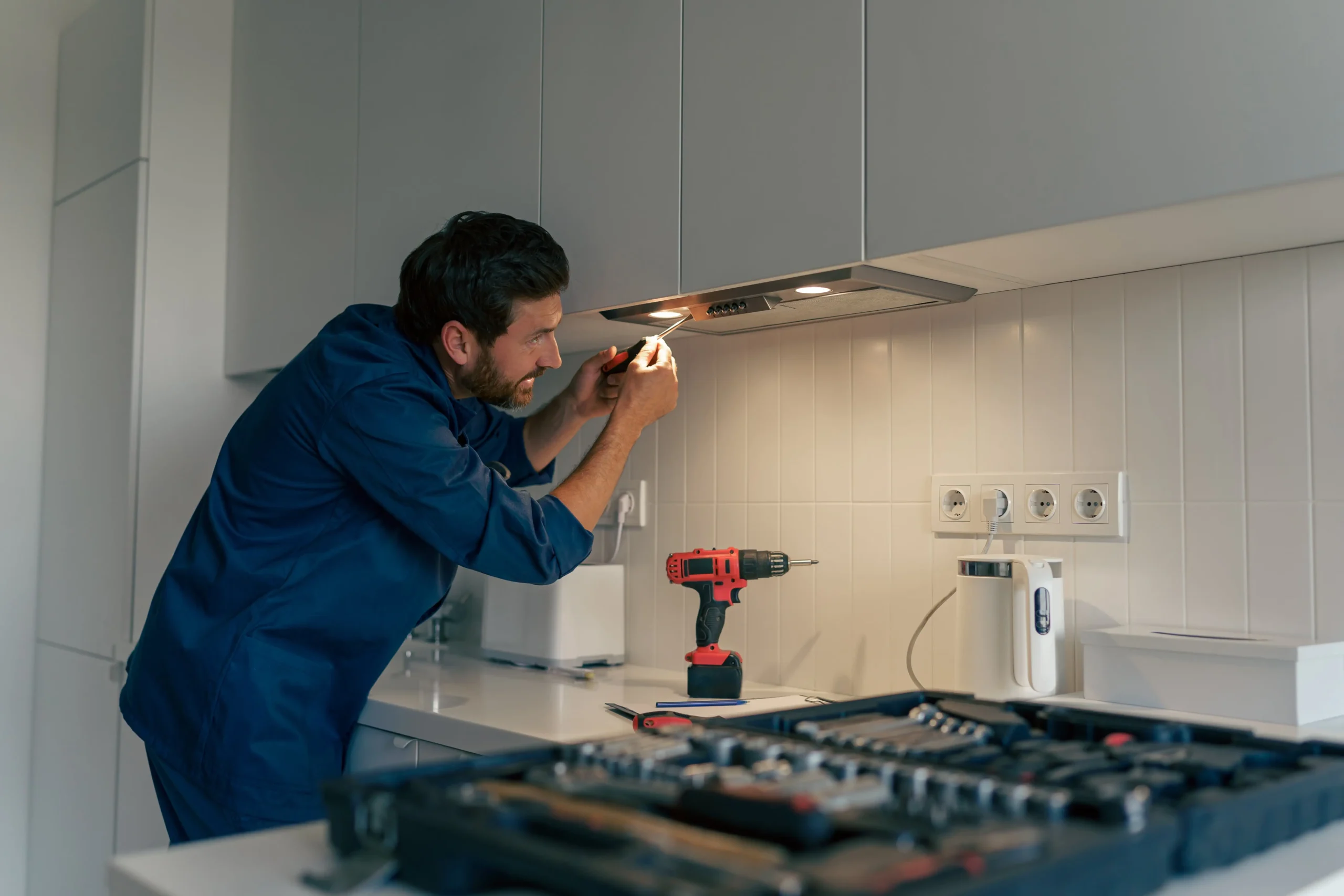 Technician repairing fridge