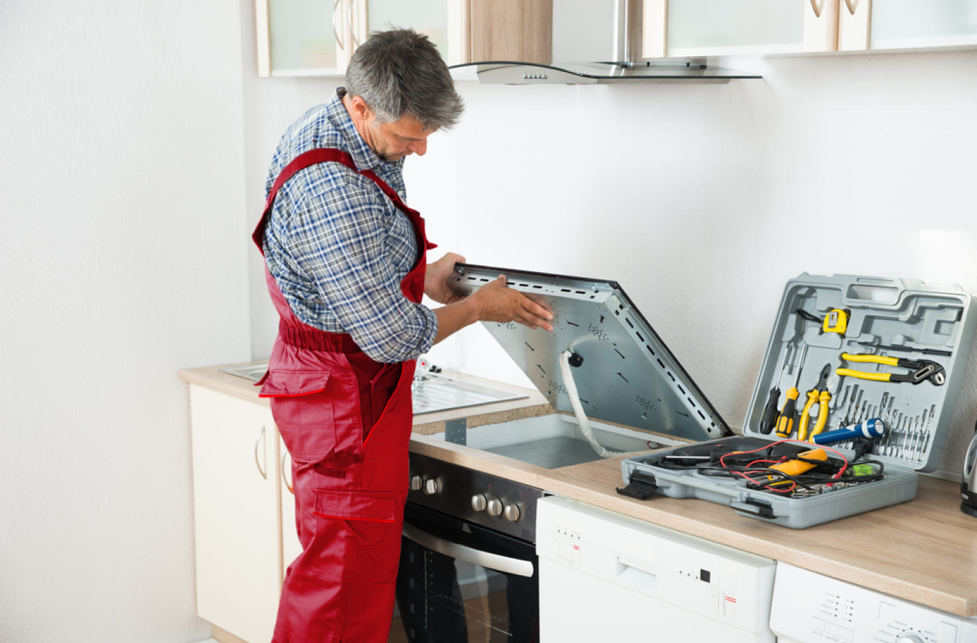 Technician repairing fridge